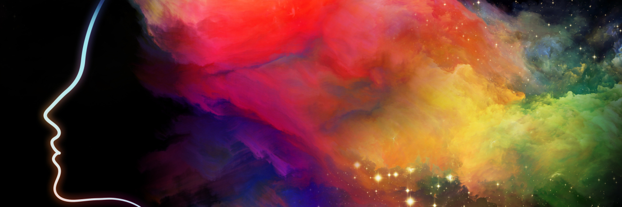 Not Feeling Alone With Anxiety A photo of a woman with colorful hair imitating clouds.