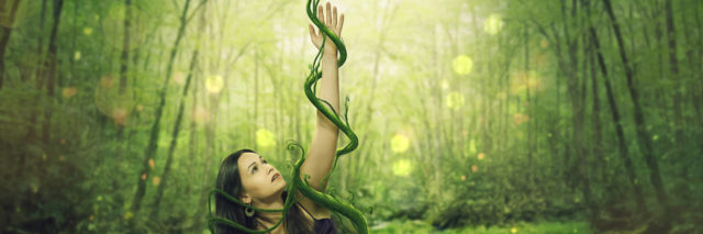 A woman held down by green vines as she reaches up.