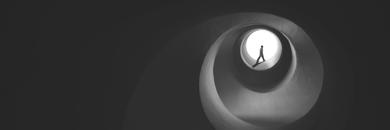 How Cognitive Distortions Send Me Spiraling Downward person in a dark, black vortex
