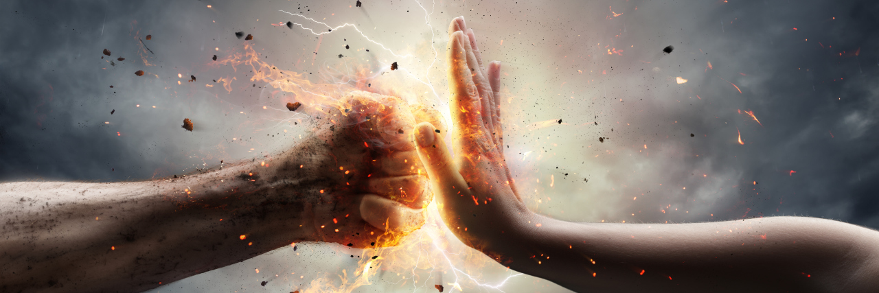 What It's Like to Fight the Dermatomyositis 'Beast' Inside Me fist coming up against a hand, trying to stop it. image of thunderstorm.