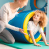 Child exercising with physical therapist.