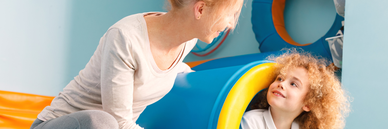 Saying Thanks During National Physical Therapist Month Child exercising with physical therapist.