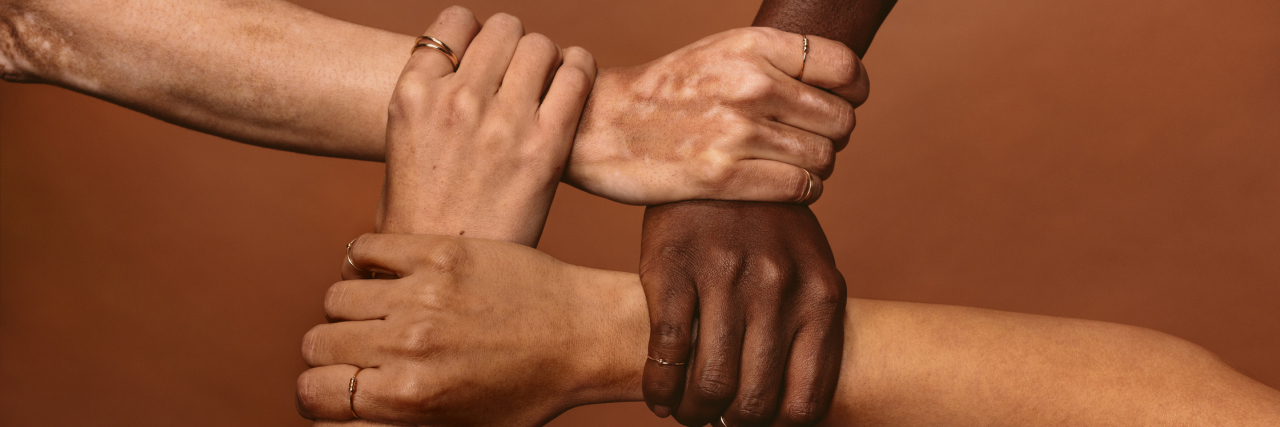 How a Suicide Support Group Helped Me After My Brother's Death A group of people holding on to each other in a circle.