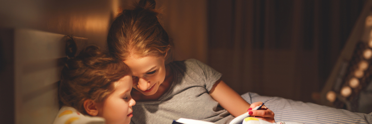 When My Child Perfectly Summed Up Living with ME/CFS Mother and child daughter reading books in bed