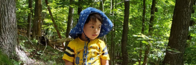 Smriti's son playing in the woods.