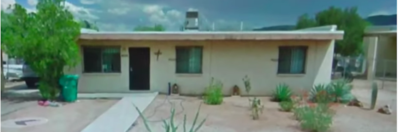 One-story white Arizona house in the desert