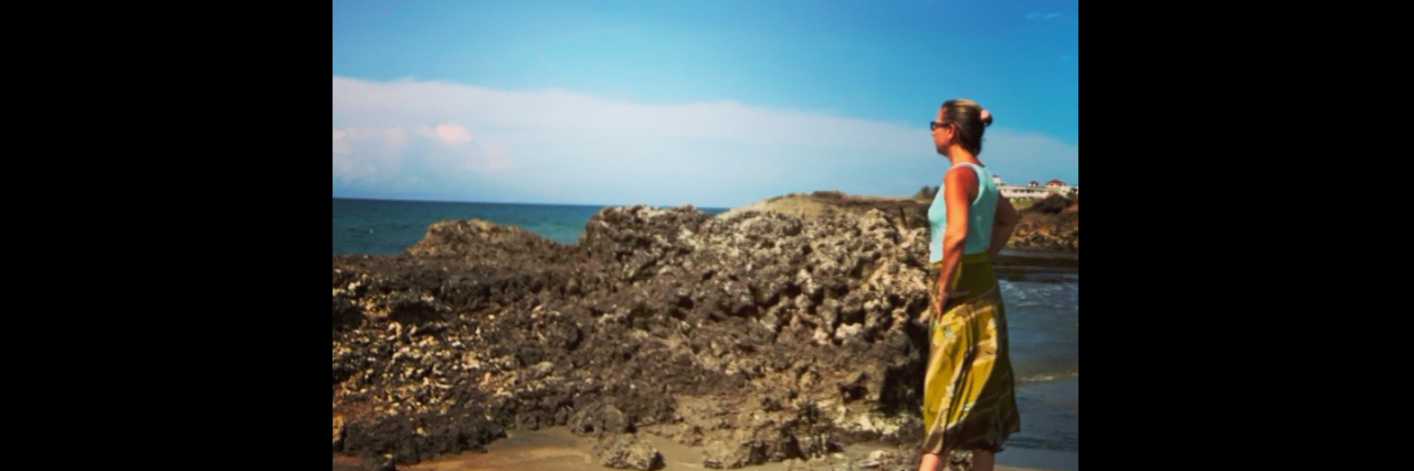 How One Trip Can Change Your Life With Depression and Chronic Illness Woman walking on the beach