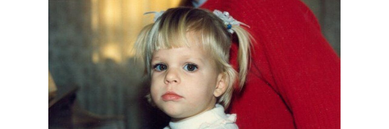 Feeling Too Much Emotion In a World That Doesn't Feel A little girl sits at a piano staring at the camera.