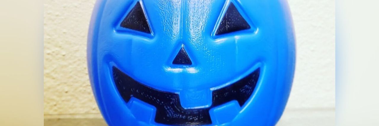 Mom Suggests Blue Bucket for Nonverbal Autistic Kids at Halloween Blue plastic Halloween pumpkin bucket
