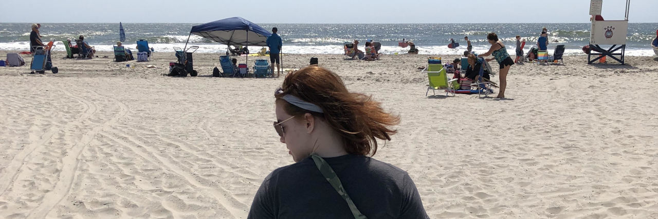 When Family Members Don't Make Their Homes Wheelchair Accessible Alyssa on a wheelchair mat at the beach.