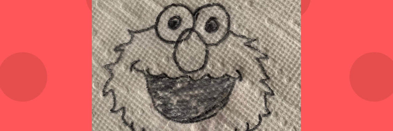 Drawing of Elmo on a napkin.