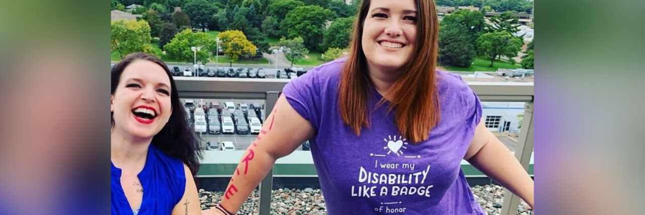 Why National Disability Employment Awareness Month Matters Erin Noon-Kay and Mollie Miller, two women with cerebral palsy. Mollie uses a power wheelchair and Erin uses a walker.