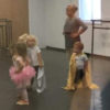 Jameson wearing a gold cape at ballet class.