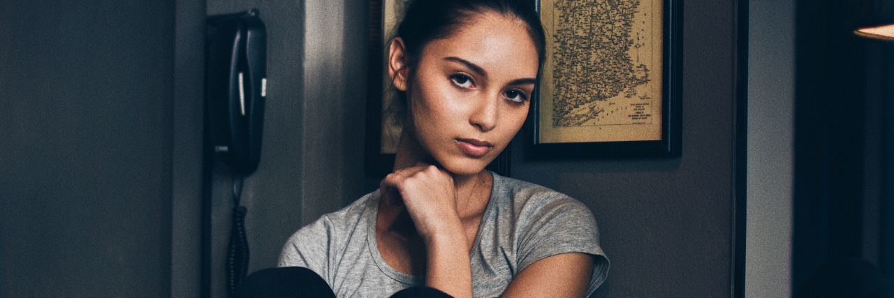 Why Depression in Borderline Personality Disorder Is Serious photo of young woman looking into camera with sad expression