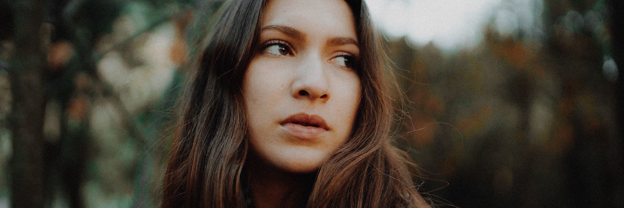 How to Cope When Rare Disease Changes Your Life A woman looking to the side