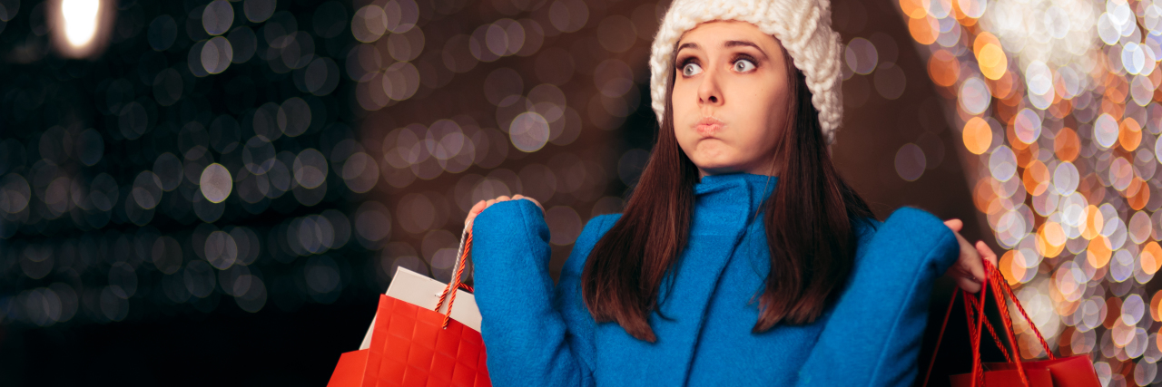 4 Tips to Maintain Balance This Holiday Season exhausted woman holiday shopping