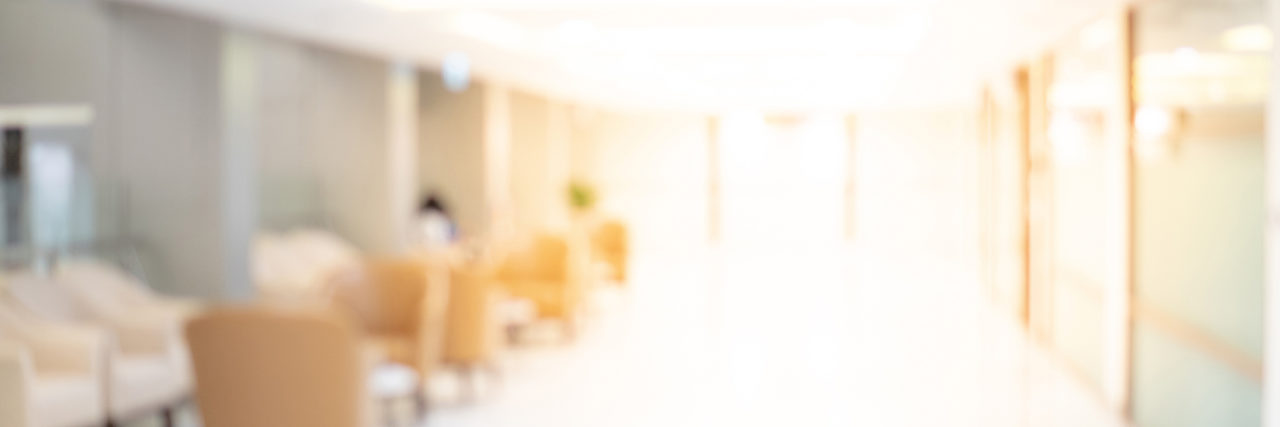 Why Affordable Mental Health Care Is Getting Harder to Access Abstract blur luxury hospital corridor. Blur clinic interior background with defocused effect. Healthcare and medical concept