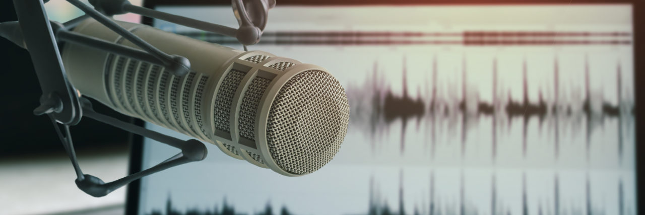 Podcasting With a Stutter Podcast microphone.