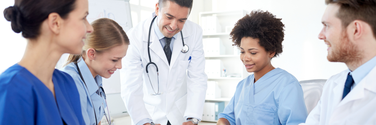 The Need for Care Coordination for Multiple Chronic Illnesses Doctors meeting to discuss patient care.