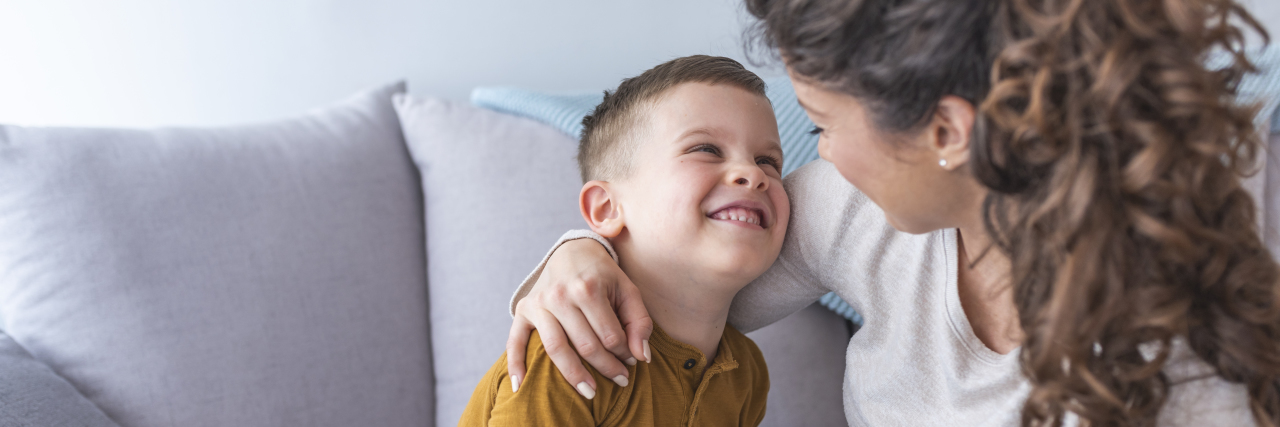 Supporting Your Child With Sensory Processing Disorder Happy mom plays with her son at home.