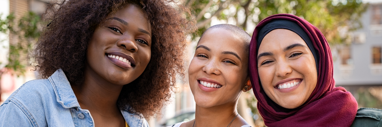 How to Meet People and Maintain Friendships When You're Sick group of three women smiling, friends