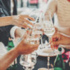 Hands toasting with champagne glasses, festive