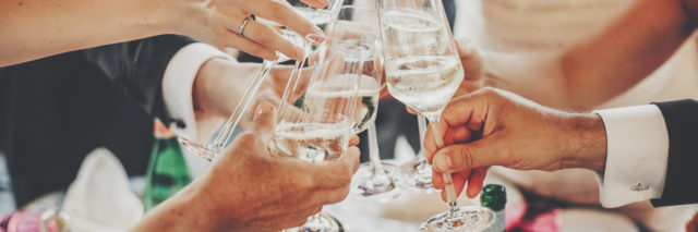 Hands toasting with champagne glasses, festive