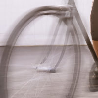 Female athlete racing on a bike. motion blurred image.