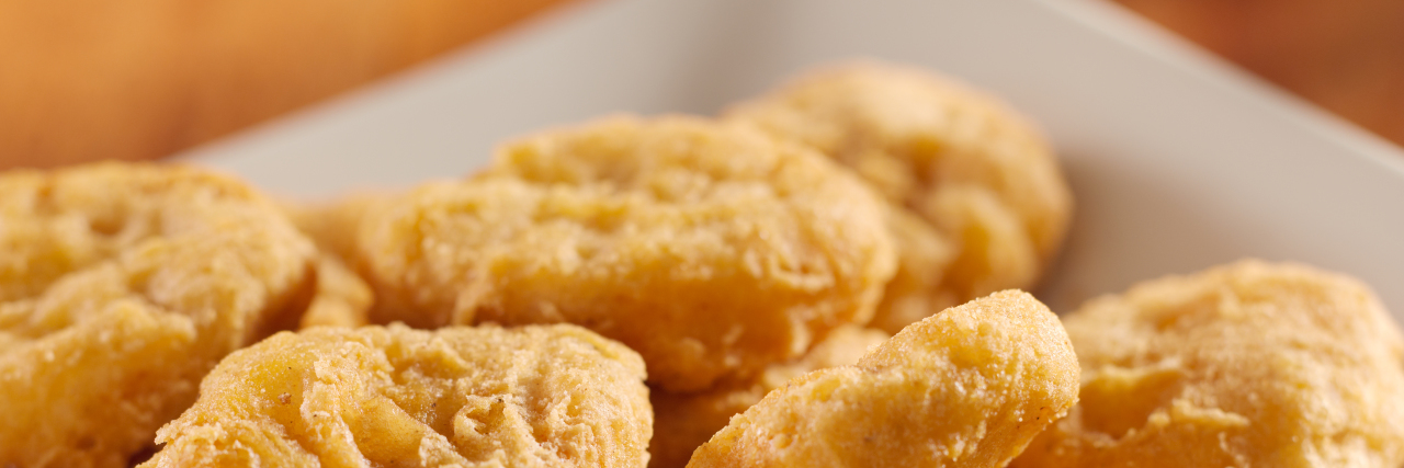 Respecting Autism Sensory-Based Dietary Needs on Thanksgiving Golden chicken nuggets on a plate.