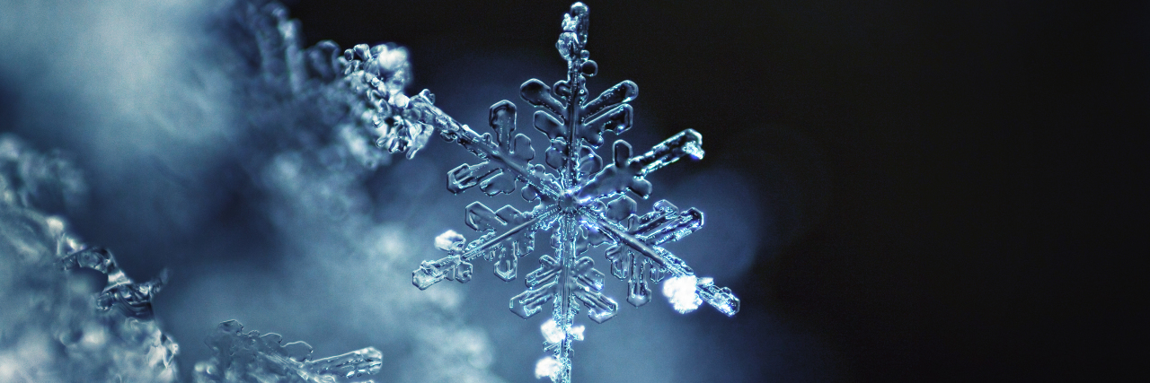 Receiving an Unexpected Multiple Sclerosis Diagnosis Snowflake on a dark night.