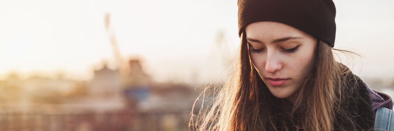 Struggling to Accept Limitations of Being Sick Portrait of a sad young student at sunset