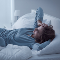 Woman sick in bed.