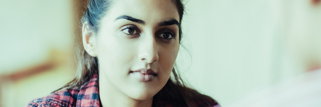 Asking Others About Their Disability: What to Remember woman focusing on conversation with another person.