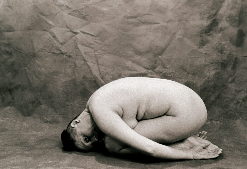 sepia tone photo of contributor Monika Sudakov posing nude for mental health awareness. © Shanna Dugan