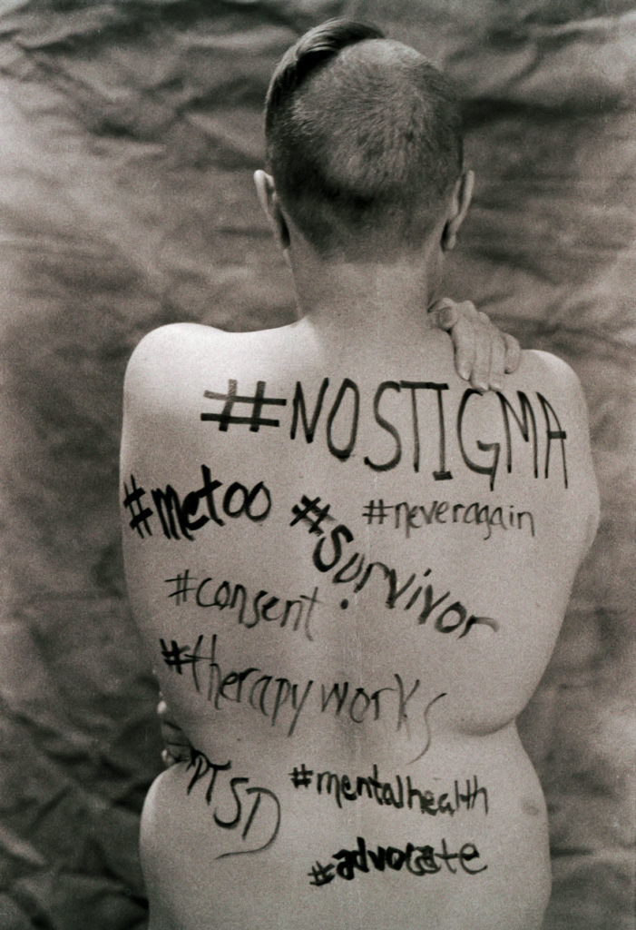 sepia tone photo of contributor Monika Sudakov posing nude for mental health awareness. © Shanna Dugan