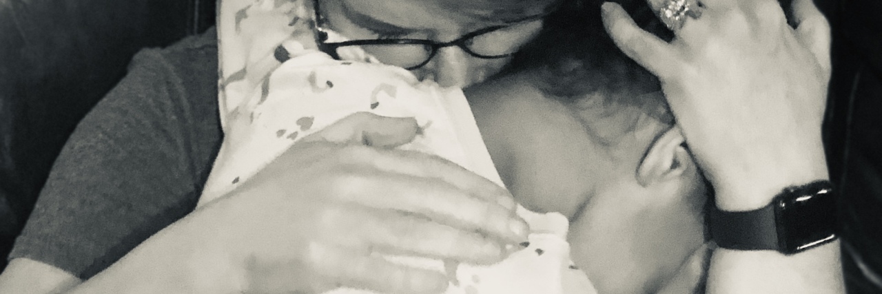 Support for Parenting Children Who Survived Trauma Deana, mother holding crying child.