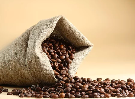 Image of whole bean coffee spilling out of a burlap bag