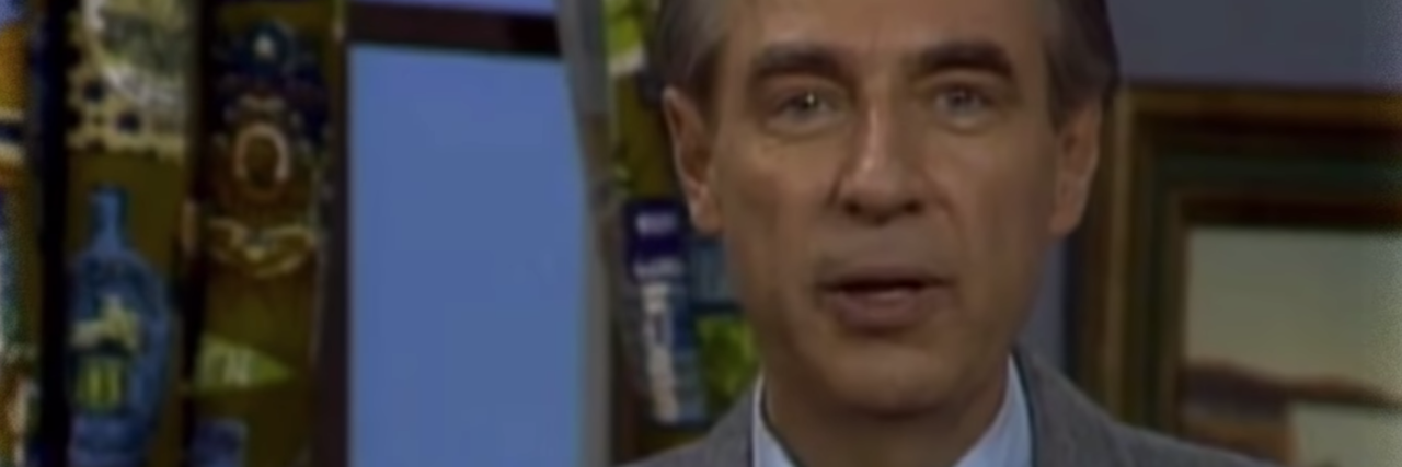 still of mr. rogers looking into camera with slight smile