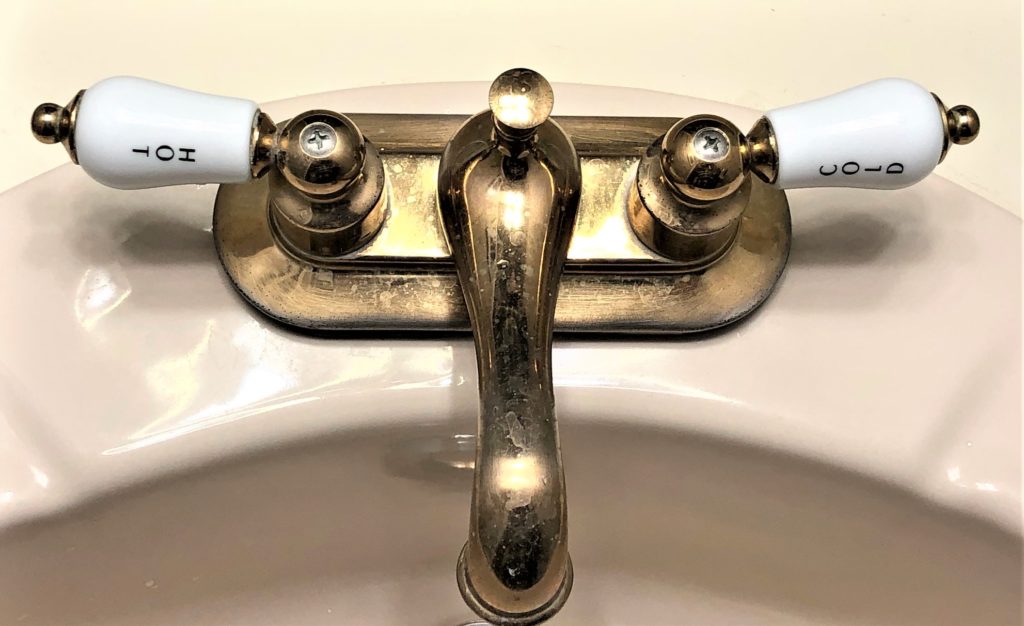 photo of faucet with hot and cold taps