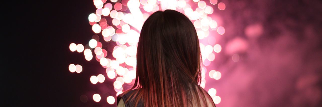 When You Dread Fireworks Because of PTSD photo of woman silhouetted by fireworks