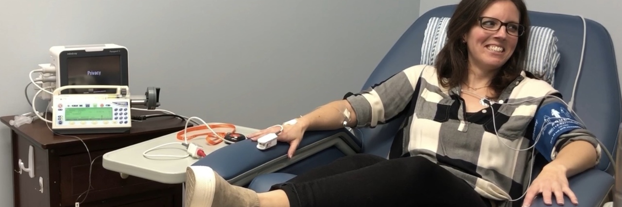 My Experience With Ketamine Infusion Therapy for PTSD photo of contributor lying on couch receiving ketamine treatment for ptsd