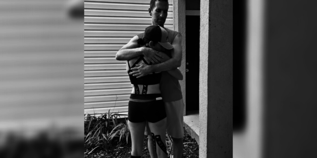 How I Stay Strong as a Marathon Runner With Chronic Illnesses Gelcys embracing her husband while wearing her running attire.