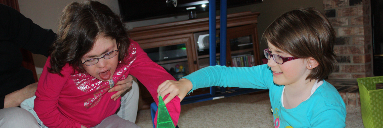 Toy Shopping for Children With Developmental Delays Michele's daughters playing together.