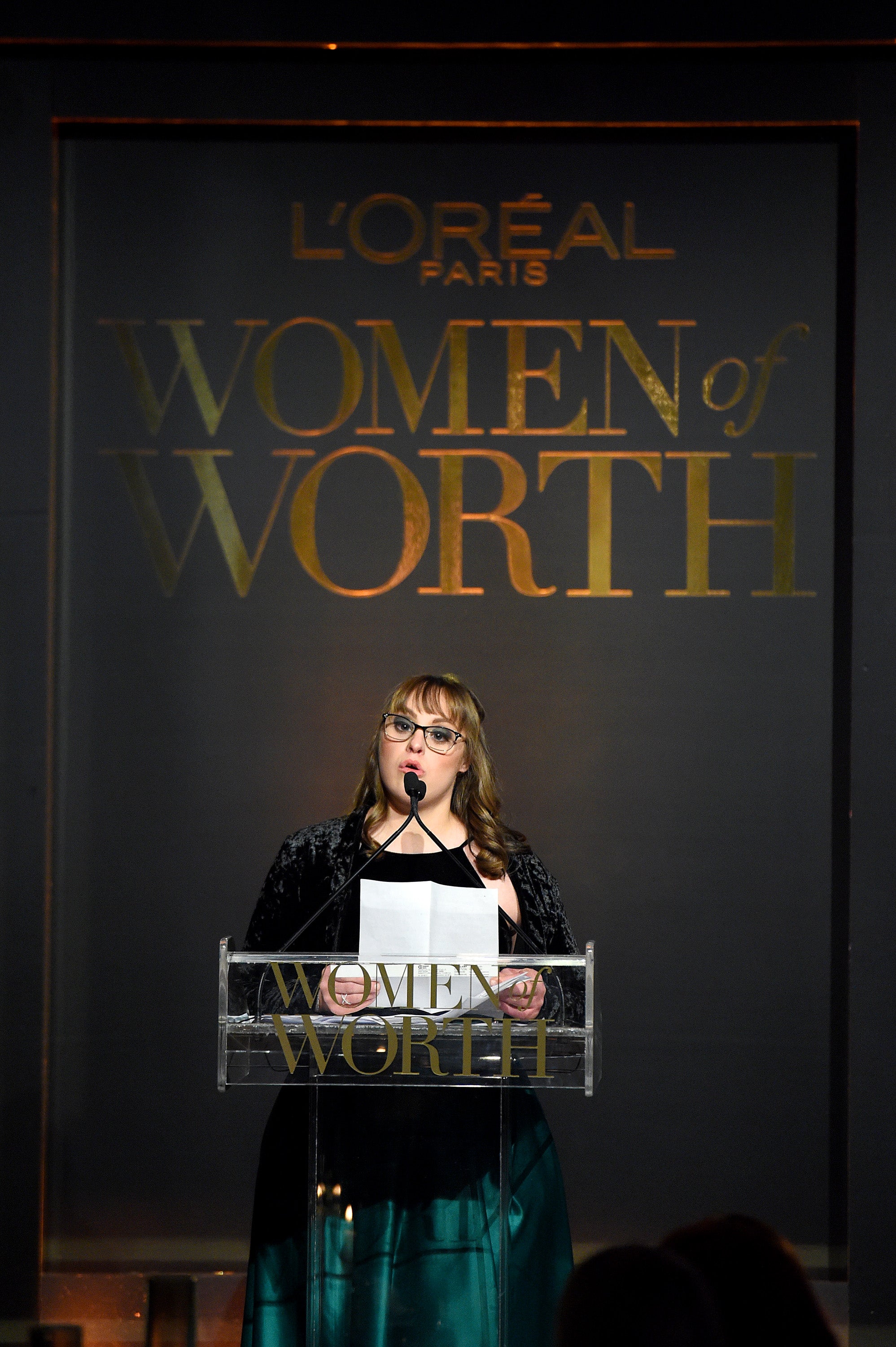 Brittany accepting her award at the L'Oreal Woman of Worth Gala.