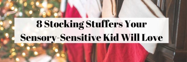 8 Stocking Stuffers Your Sensory-Sensitive Kid Will Love - Photo of red stockings on fireplace next to a tree
