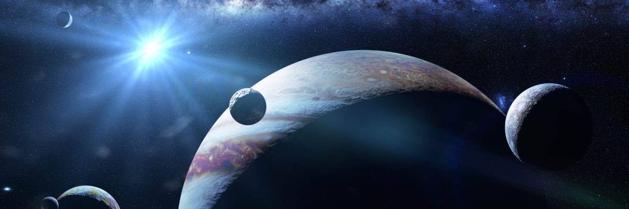 Becoming a Caregiver After My Son's Spinal Cord Injury Planet Jupiter with some of the 69 known moons lit by the Sun and the galaxy.