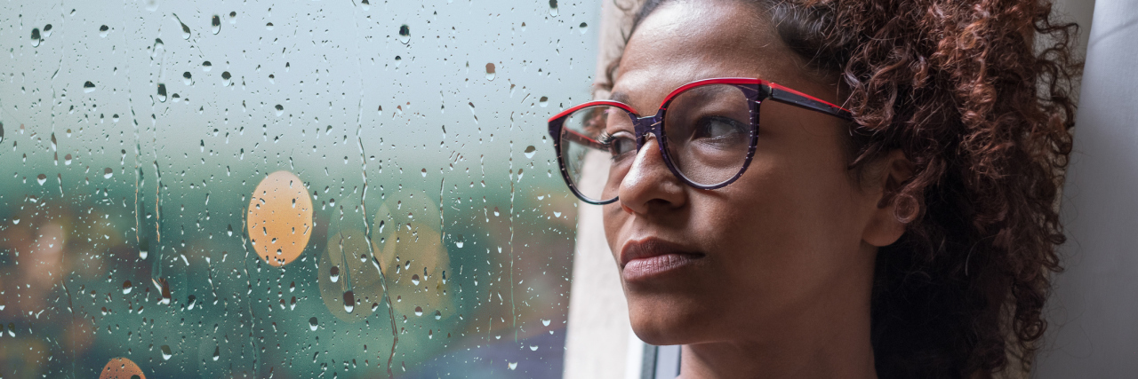 Depression Therapy Can Help You Reclaim Your Life Sad african american girl looking out of the window on rainy weather