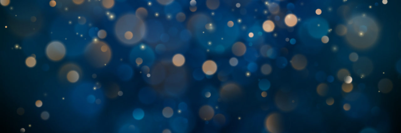 Abstract glitter defocused blinking stars and sparks.