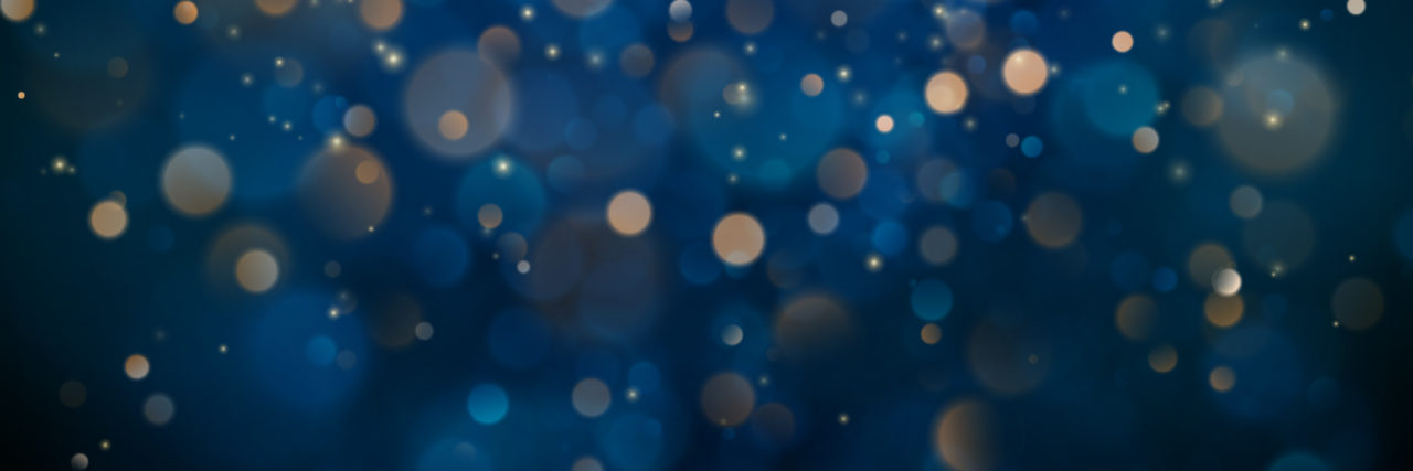Unique Challenges of Families Facing Rare Disease Abstract glitter defocused blinking stars and sparks.
