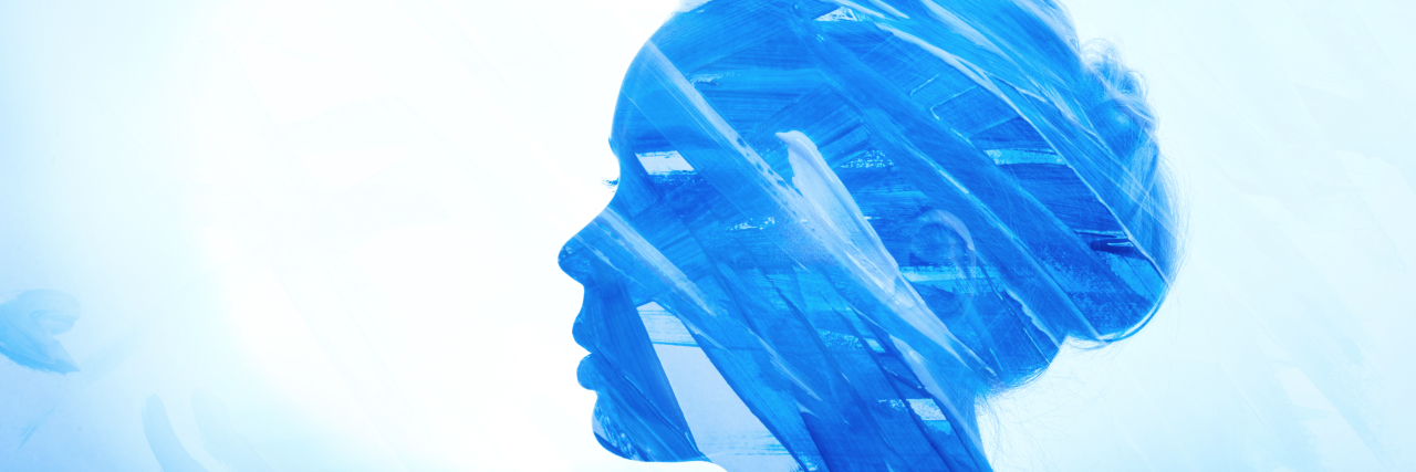 Experiencing Brain Fog Before a Fibromyalgia Diagnosis Portrait woman consisting of brush strokes of blue paint on a white background.